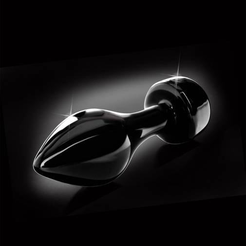 Pevný sklenený análny kolík čiernej farby s ´poistkou pri vkĺznutiu do análu.