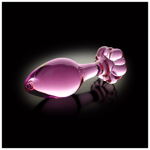 Luxusný sklenený análny kolík ružovo priehľadnej farby so spodnou stranou v tvare kvetiny.