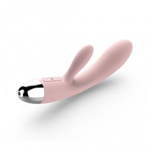 Vysokokvalitný vibrátor jemne ružovej farby so stimulátorom klitorisu a G bodu.