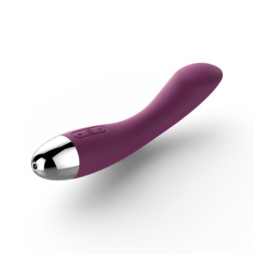 G bod elegantný vibrátor zo silikónu fialovej farby s mierne ohnutým tvarom.