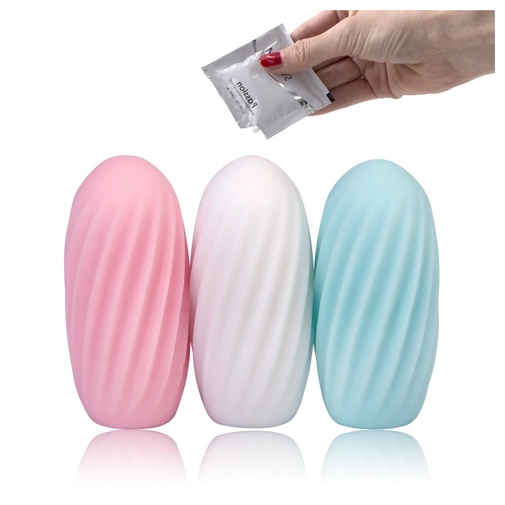 Tri masturbačné vajíčka v troch rôznych farbách a ženská ruka držiaca lubrikačný gél.