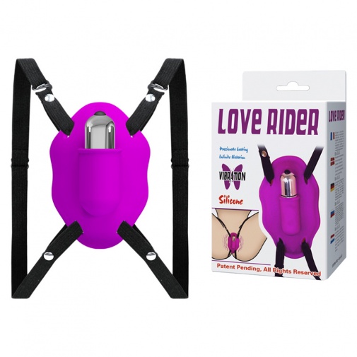 V balení stimulátor vagíny a klitorisu Lover Rider fialovo-ružovej farby.