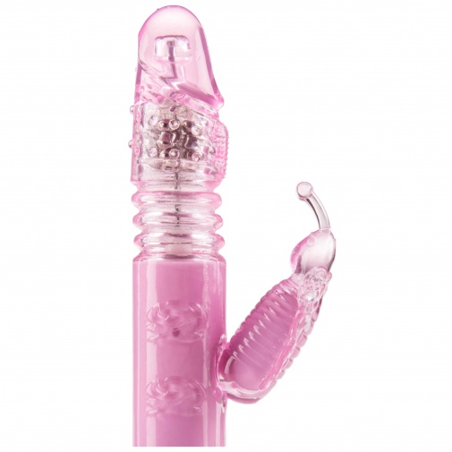 Ružový želatínový vibrátor s priehľadnou špičkou a stimulátorom klitorisu.