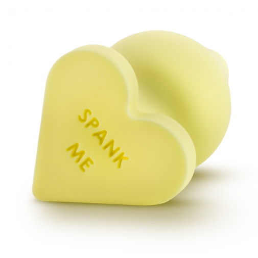 Malý žltý análny kolík pre začiatočníkov s nápisom Spank me.